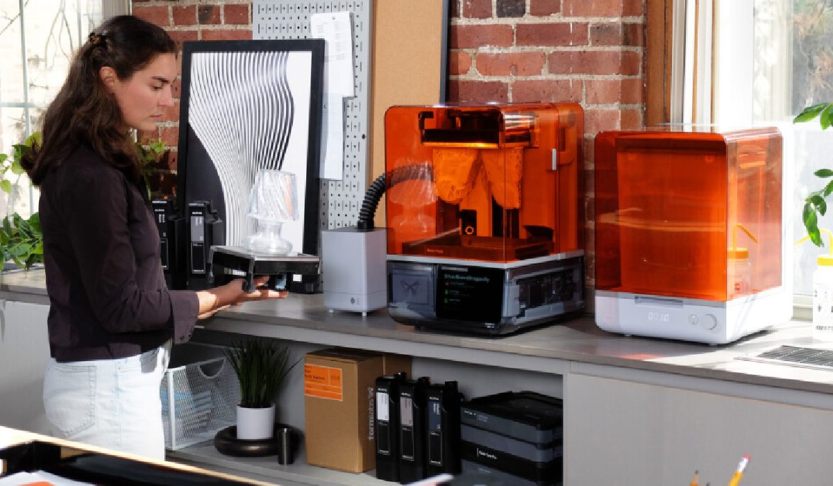 Formlabs VOC Extractor filtration system next to a photopolymer 3D printer and equipment for post-processing SLA models